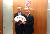Prof. Fok Tai-fai (right), Pro-Vice-Chancellor of CUHK presents a souvenir to Prof. Chen Zhimin, Associate Vice-President of FDU